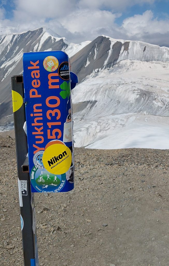 Summit post box and view from Yukhin Peak